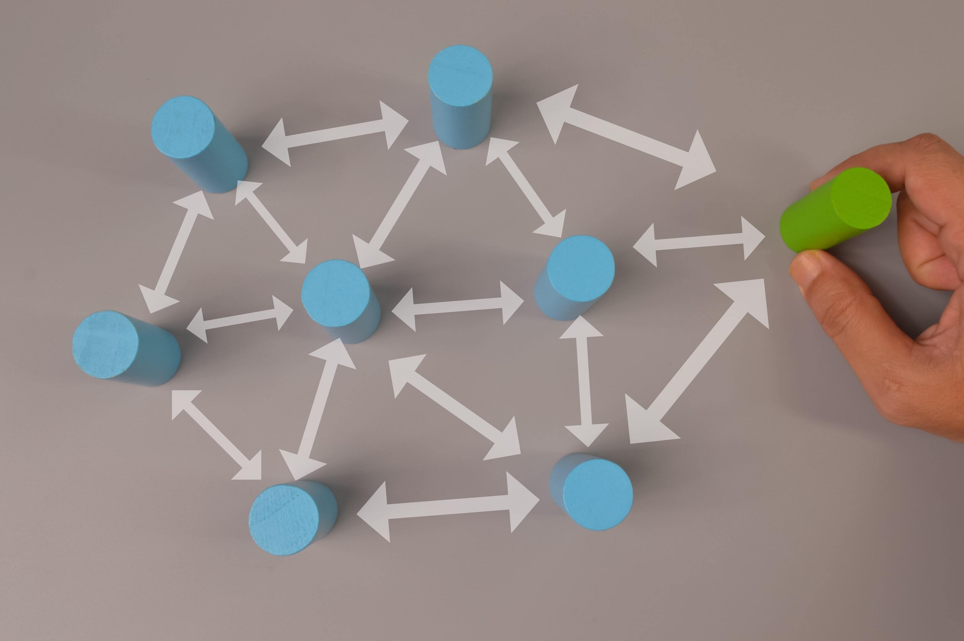 a bunch of blue peg blocks with white arrows pointing to one another